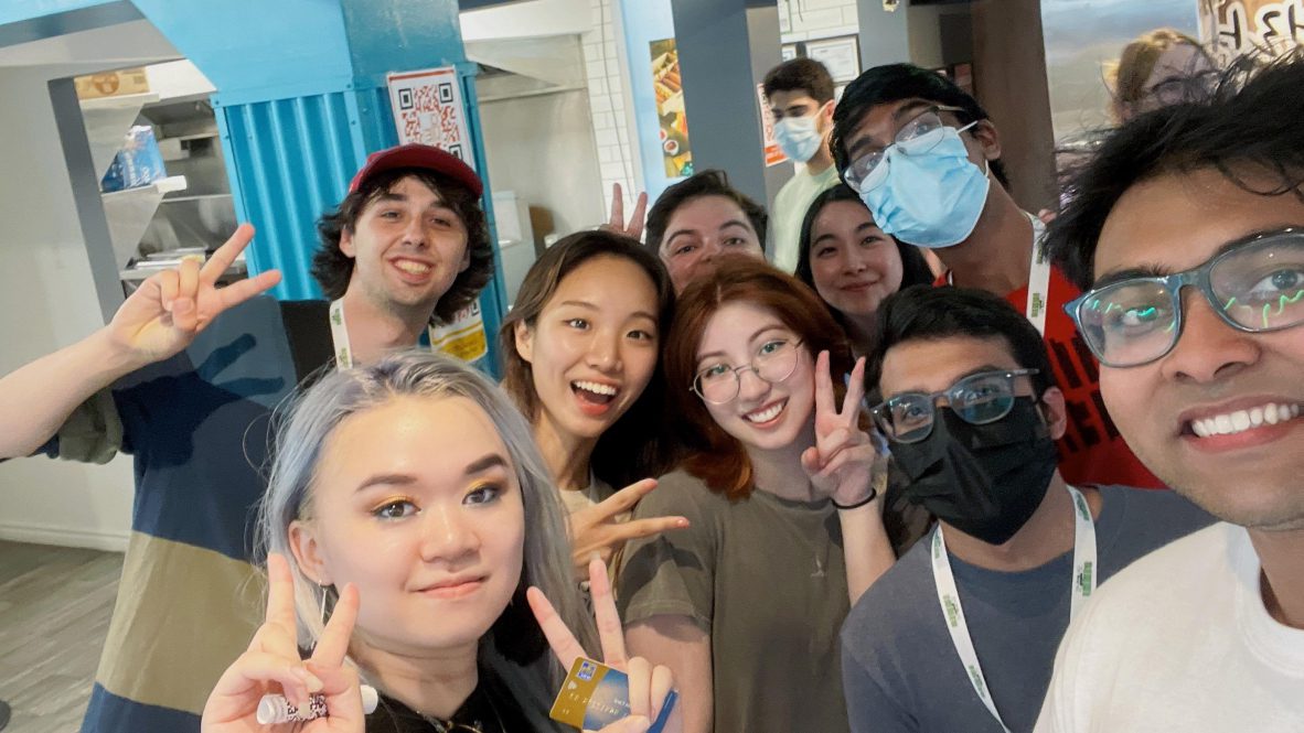a group of innis student poses in a fast food restaurant
