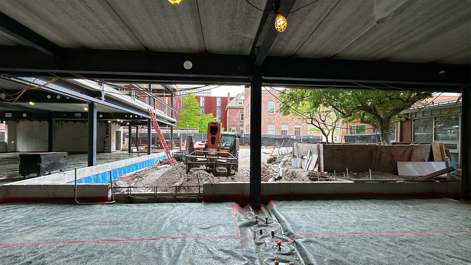Mid-construction photo of Town Hall lounge and Innis Green facing north