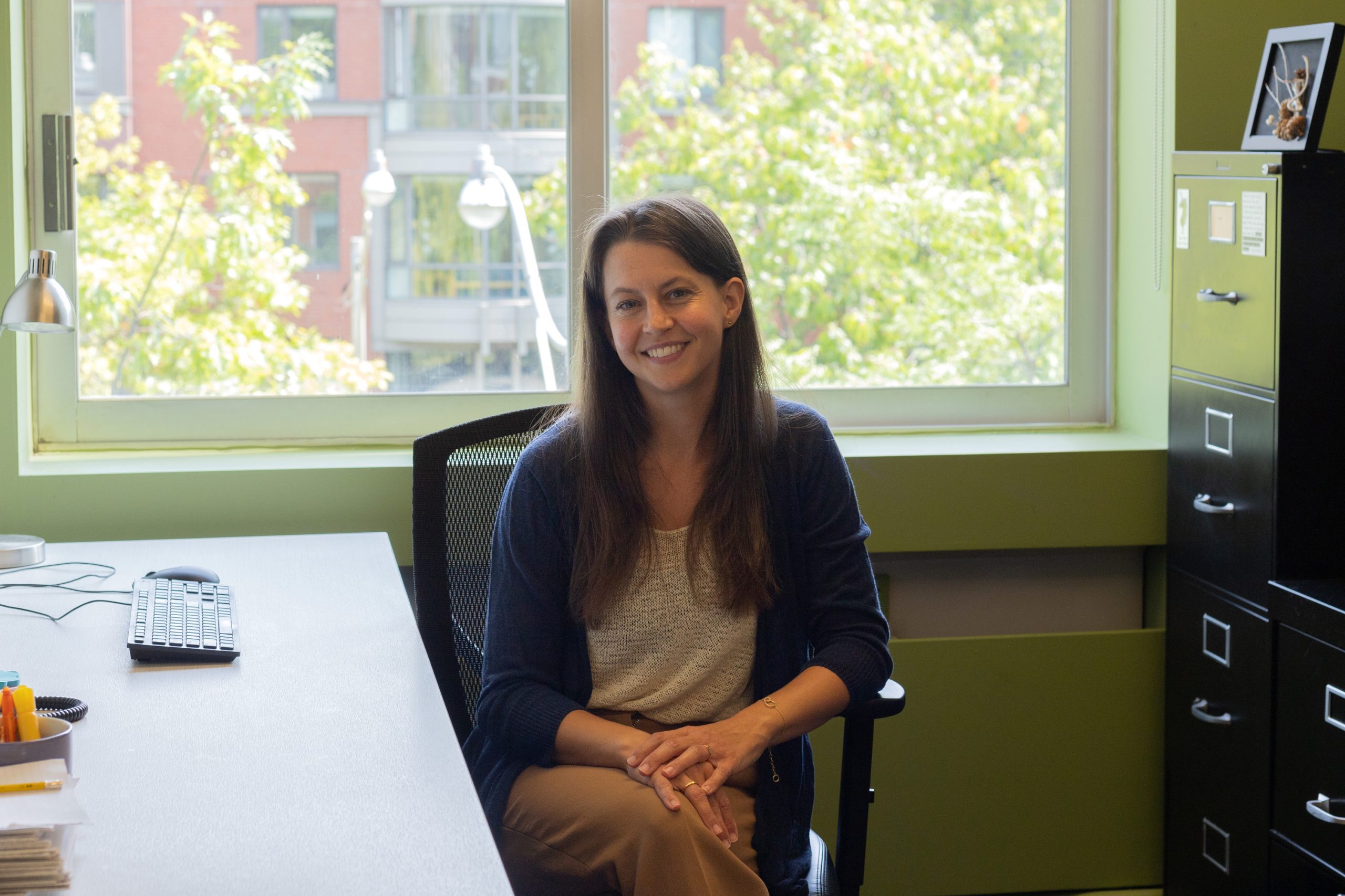 instructor sits at desk in writing centre