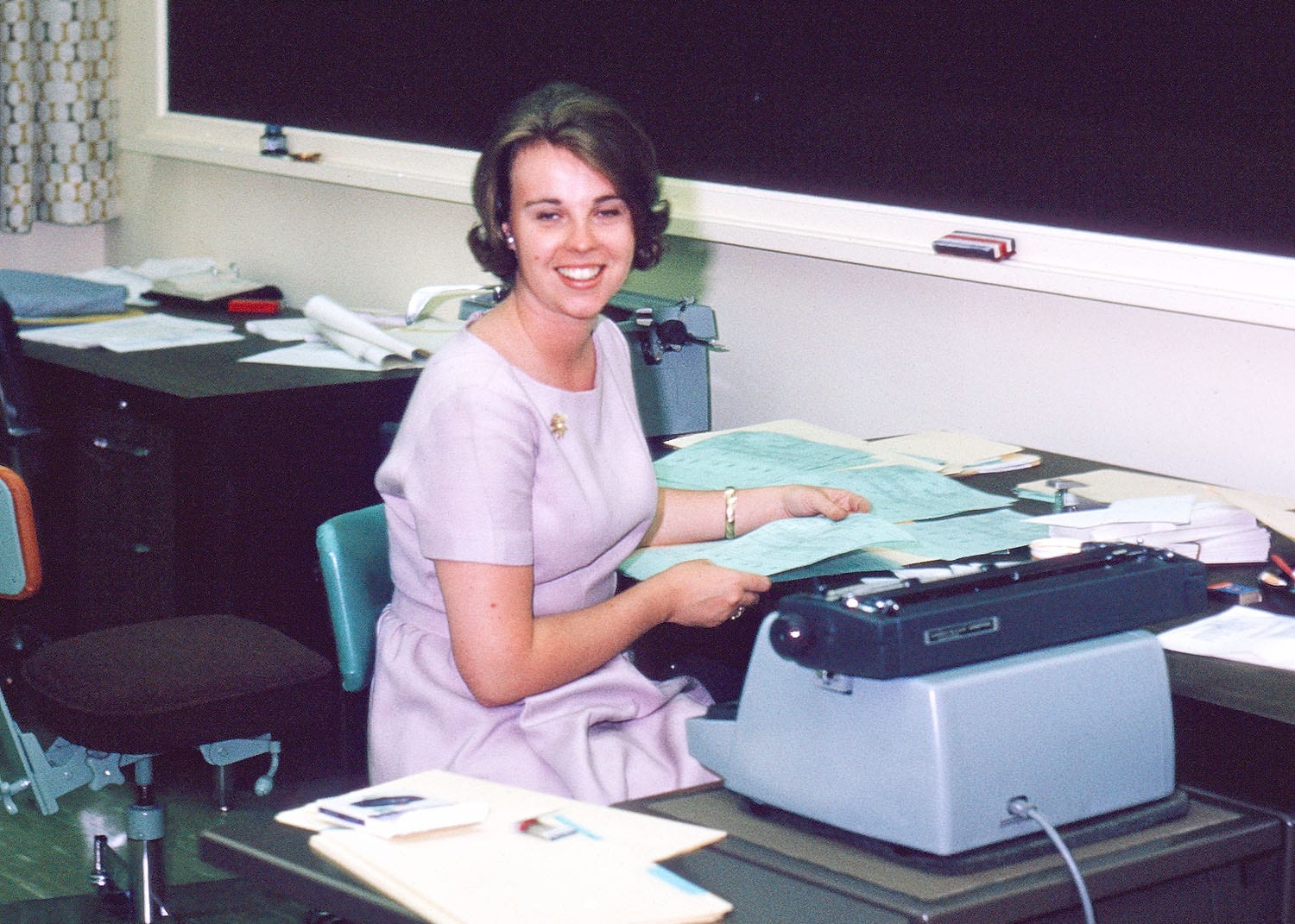 Mary Pat McMahon, Assistant to the Registrar Geoffrey Payzant, at her typewriter in the Writing Lab.