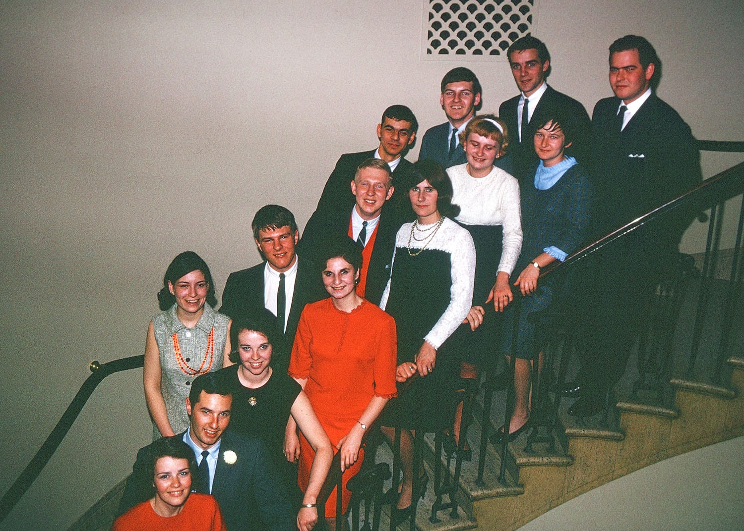 People posing on staircase
